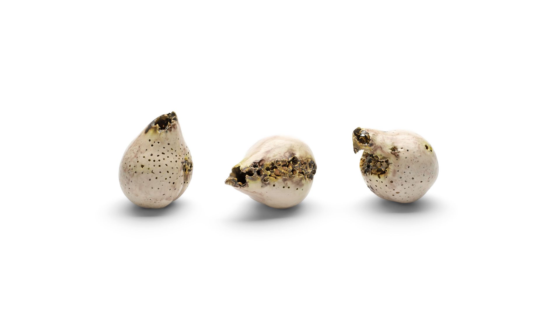 Three ceramic white pears with gold